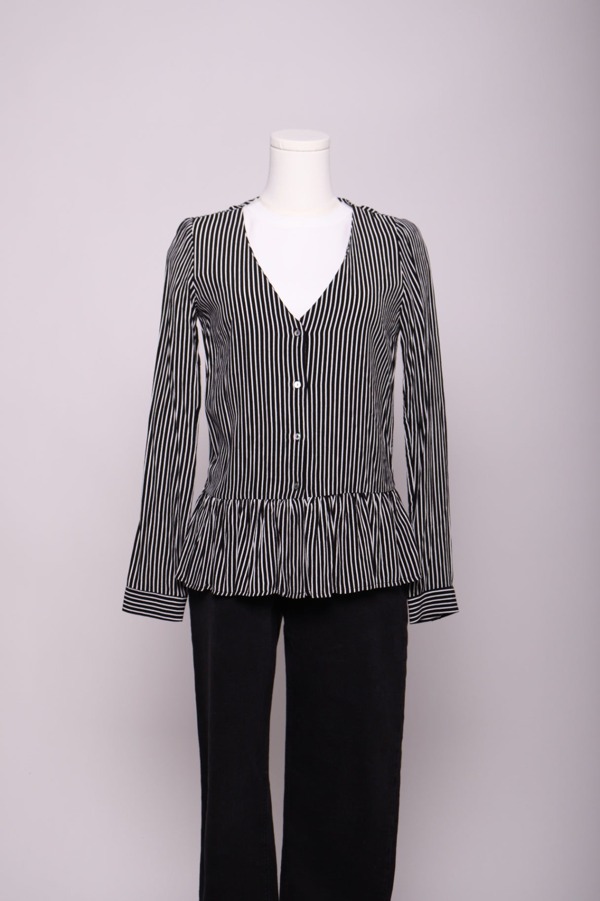 Blouse rayée à volant bas