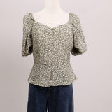 Blouse fleurie à manches bouffantes