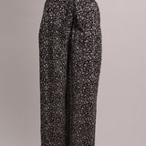 Pantalon noir ample avec motif fleuri