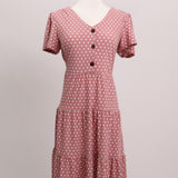 Robe midi rose à pois blancs