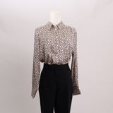 Blouse satinée à pois