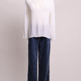 Blouse plissée blanche à col volants