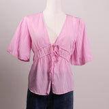 Blouse rose double nœud