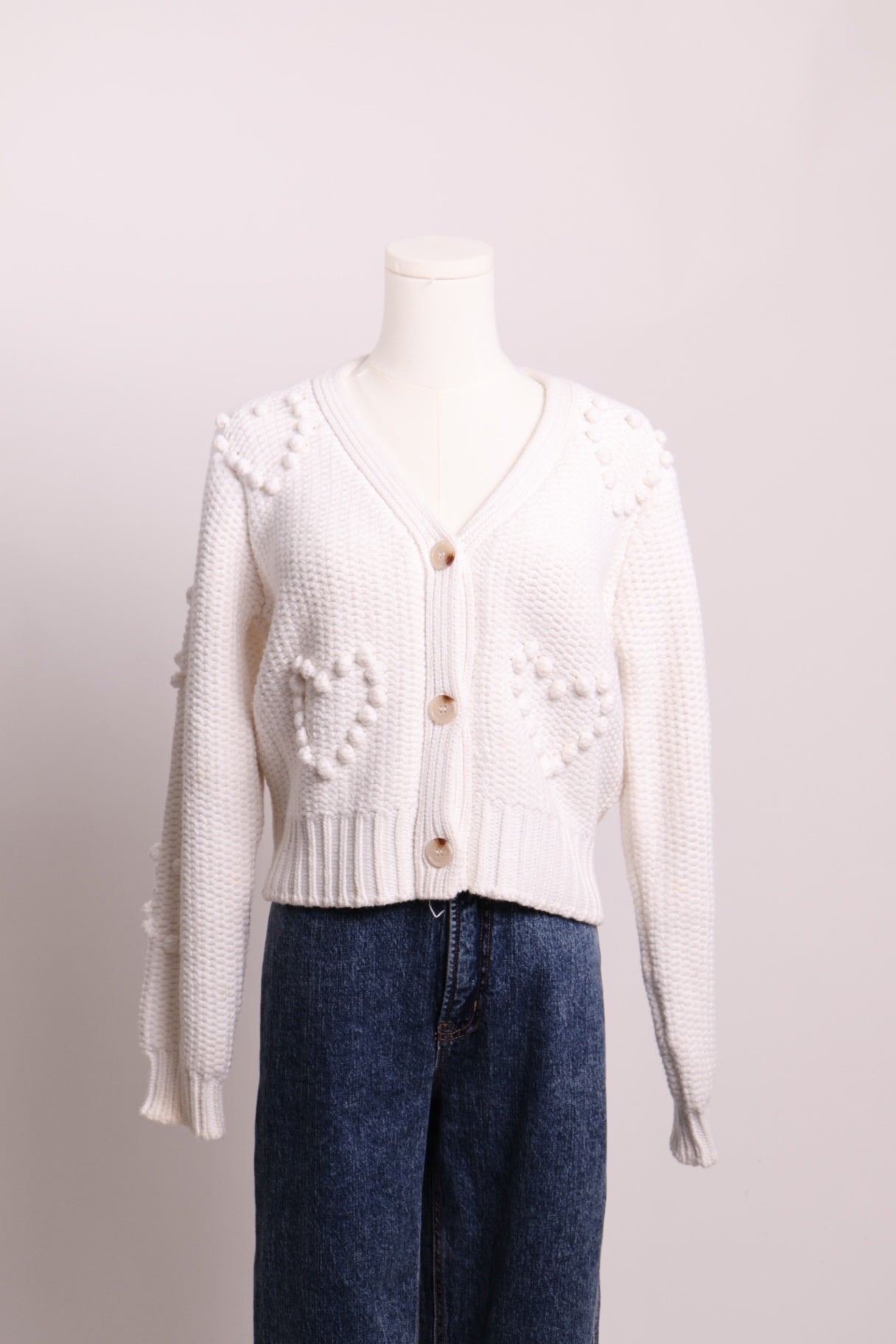 Cardigan en maille avec coeurs en relief