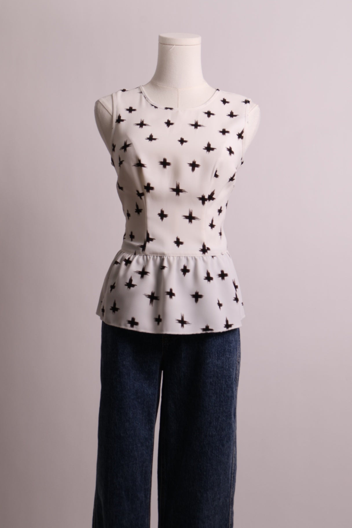 Camisole péplum sans manches