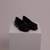 Ballerines noires lustrées avec boucle