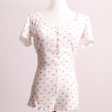 Combinaison-pyjama crème avec petites fleurs roses