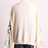 Cardigan en tricot avec motif de boucles