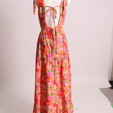 Robe fleurie avec nid d'abeille au devant et bretelles à boucles
