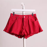 Short avec jambes effilochés