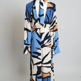Robe longue à motifs abstraits avec ceinture assortie