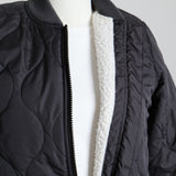 Manteau mi-saison matelassé doublé en sherpa