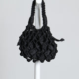 Sac avec tressage de corde nouée