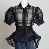 Chemise noire transparente à carreaux 