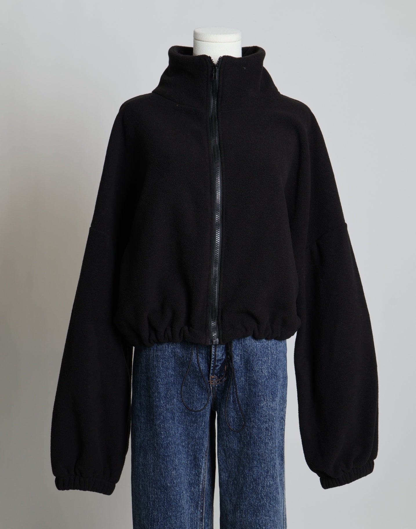 Veste courte en polaire avec taille ajustable au bas