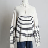 Pull en maille côtelé avec rayures noires et col zippé