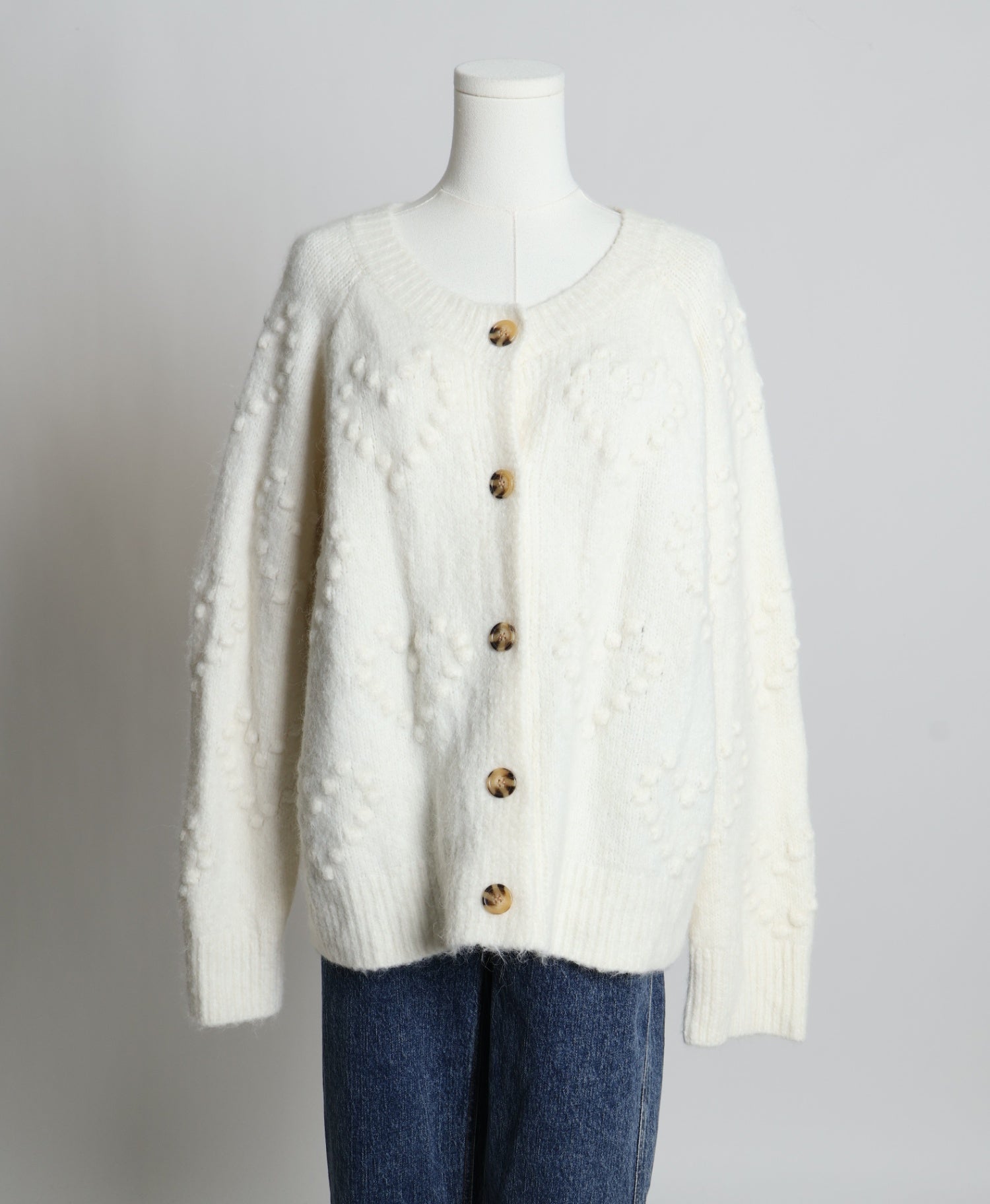 Cardigan en maille texturée avec un motif de coeurs