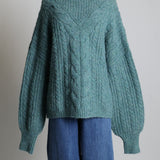 Pull en tricot à mailles torsadées