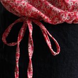 Blouse à motif floral et liens ajustables